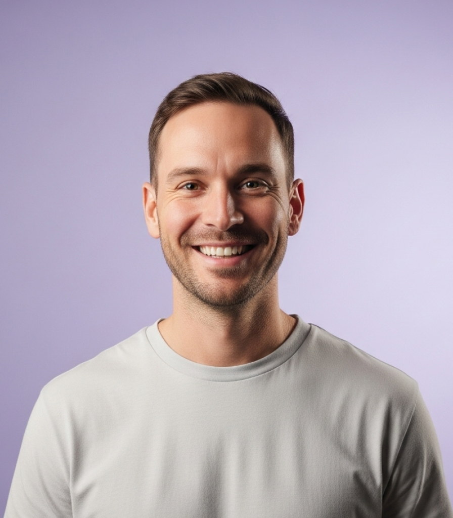 Lucas Bennett, Creative Director, smiling in a studio portrait